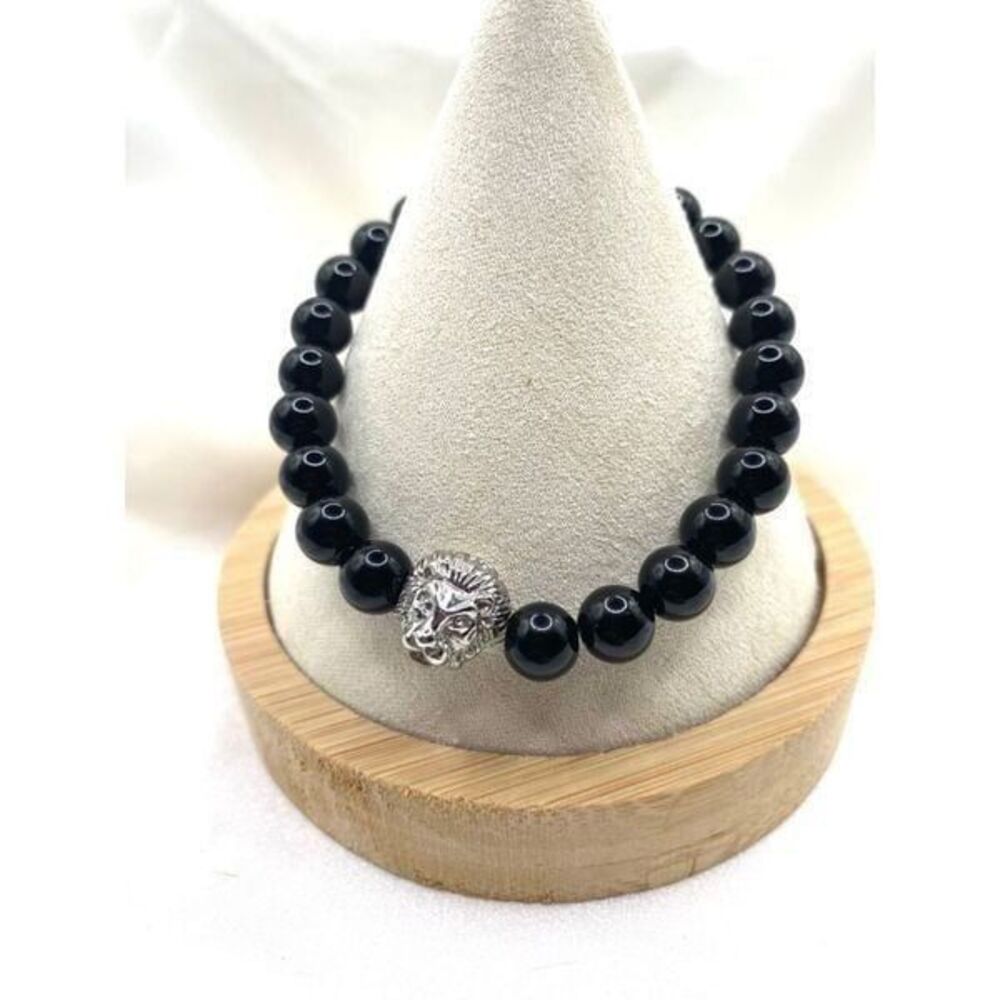 Jet black round glass beaded stretch bracelet with silver toned lion charm